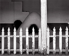 Fence and Horno, New Mexico. Black and white photograph