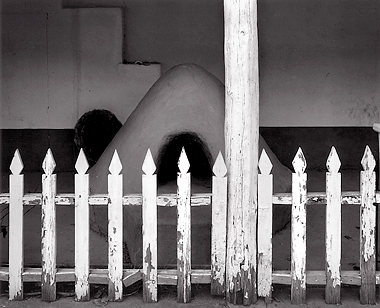 Fence and Horno, New Mexico. Black and white photograph