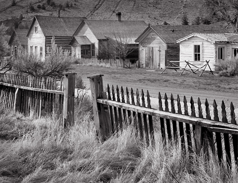 Fence and buildings, Bannack, MT. Black and white ghost town photograph