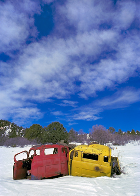 Junk Trucks In Snow, 1980. Alton, Utah. Color Photograph